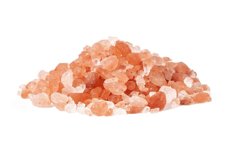 Raw Himalayan salt crystals isolated on a white background