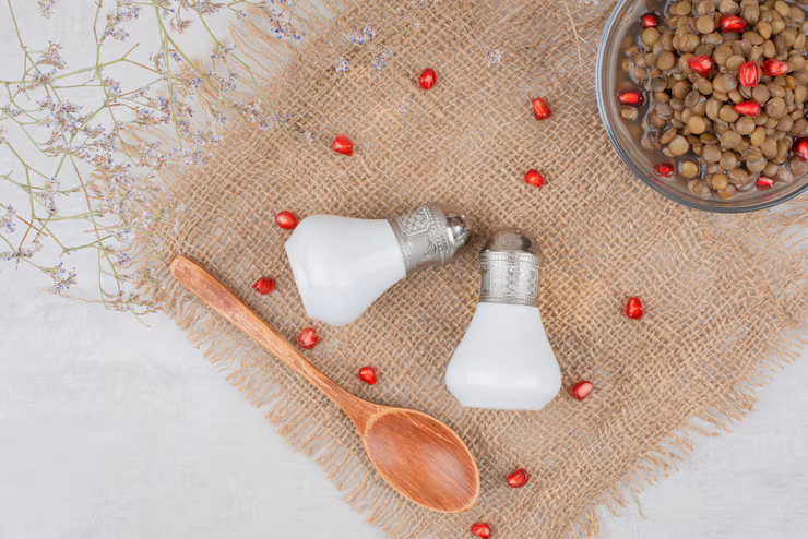 Himalayan pink salt used to season a bowl of beans and pomegranate seeds