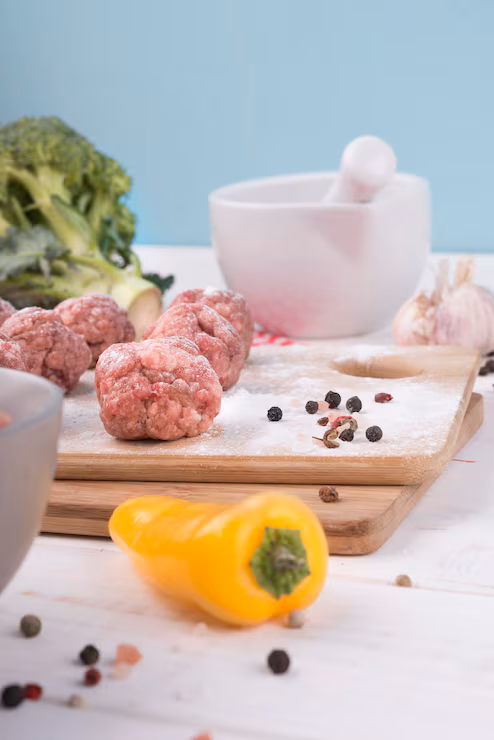 Seasoning ingredients including salt prepared for cooking on a wooden board